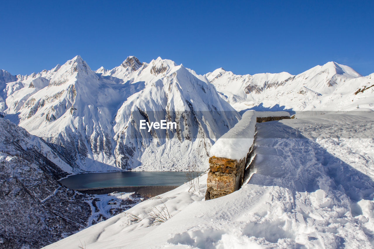 Scenic view of snowcapped mountains against sky