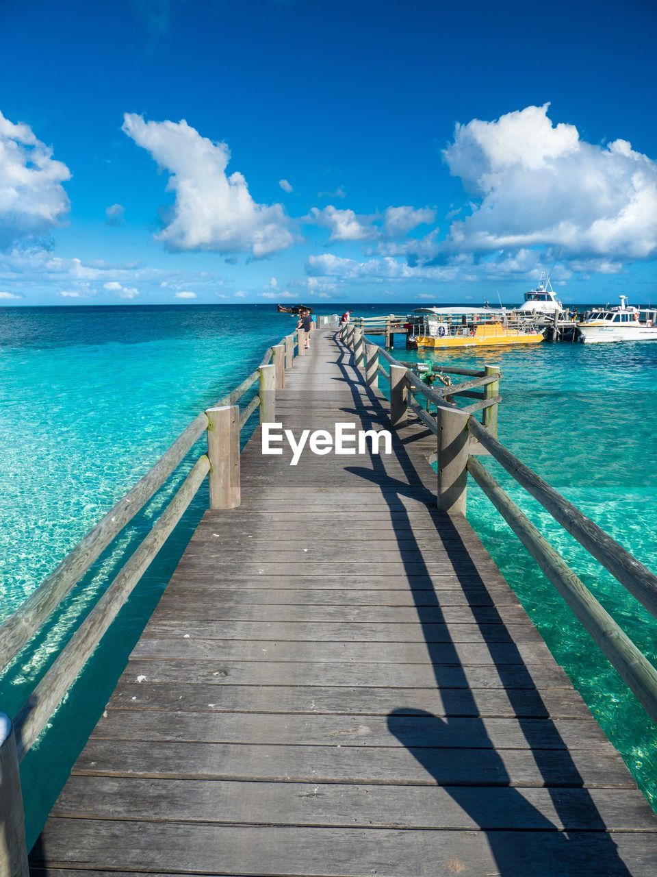 Pier over sea against sky