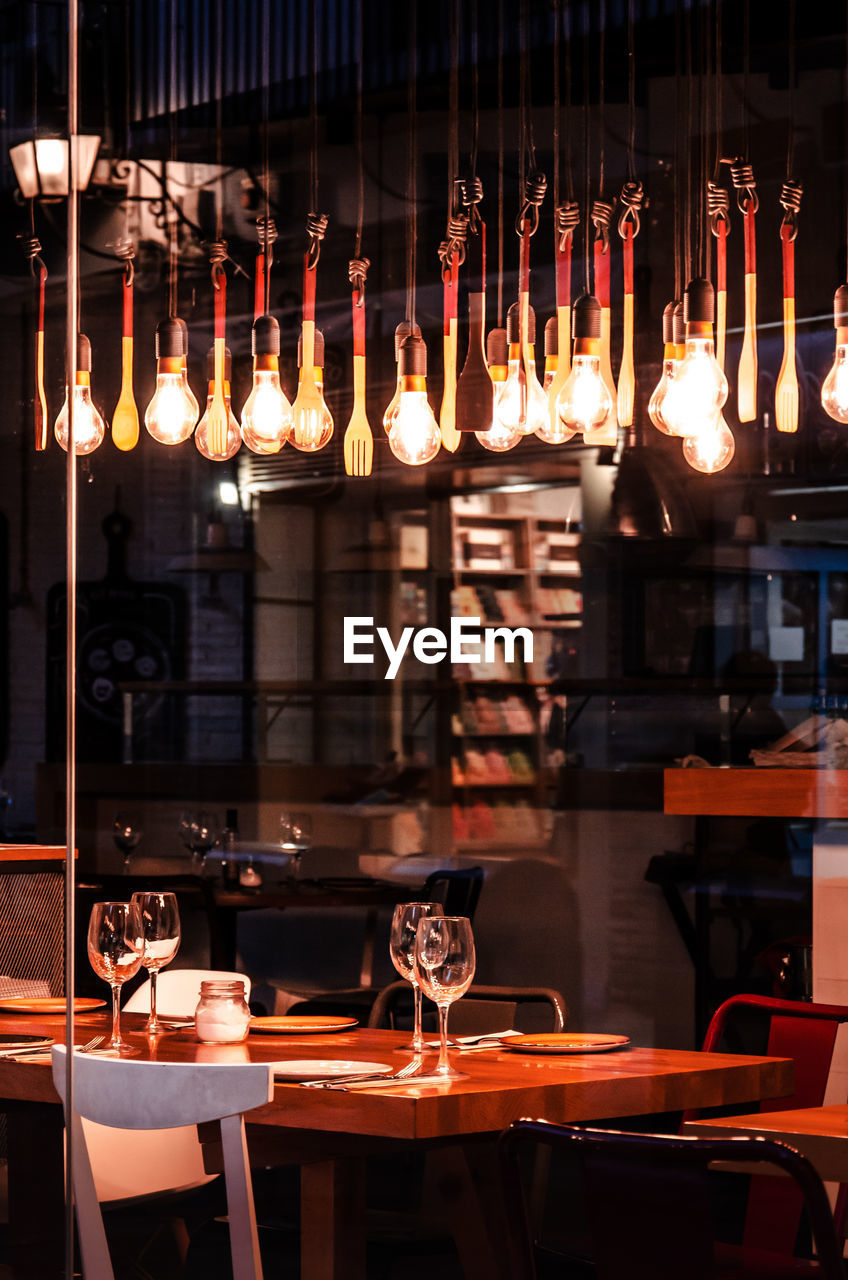 VIEW OF CANDLES IN GLASS RESTAURANT