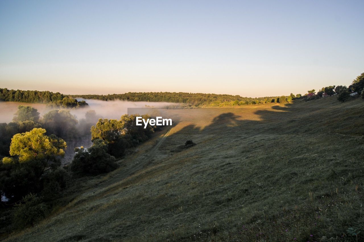 HIGH ANGLE VIEW OF LAND AGAINST SKY