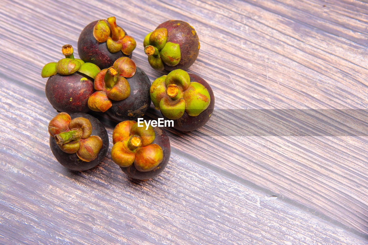 CLOSE-UP OF FRUITS ON TABLE