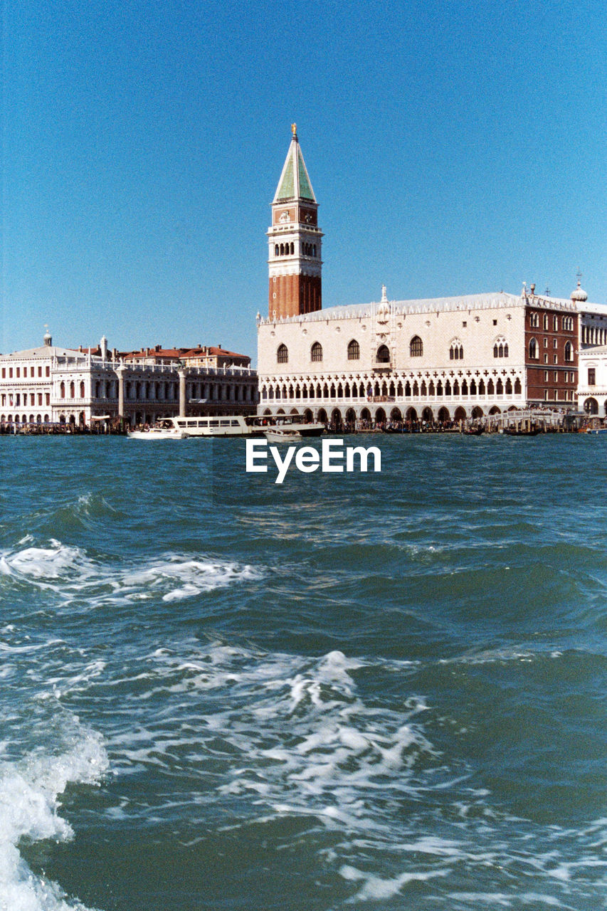 View of sea against buildings