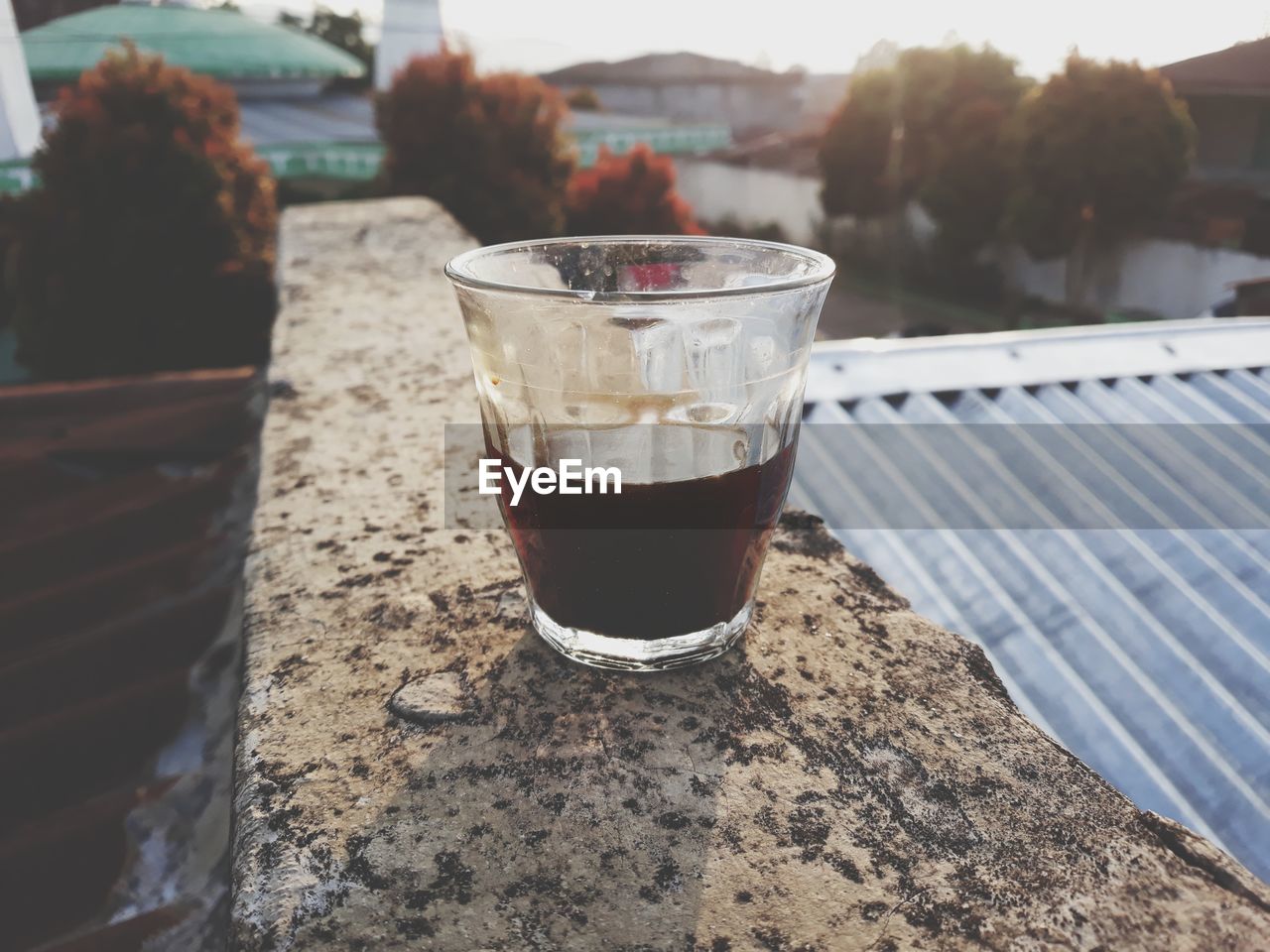 CLOSE-UP OF COFFEE ON TABLE AT SHORE