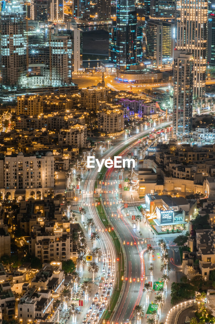 high angle view of illuminated city street at night