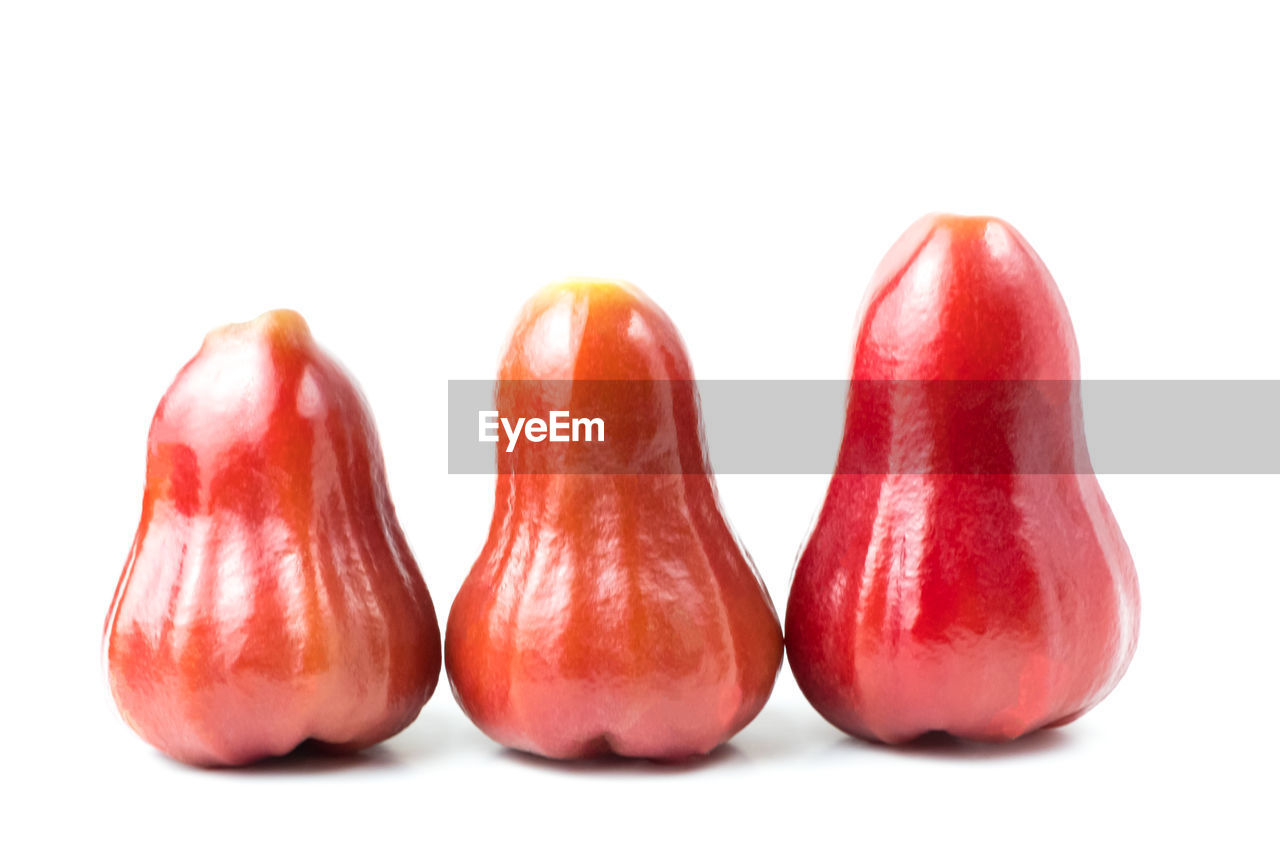 Close-up of water apples on white background