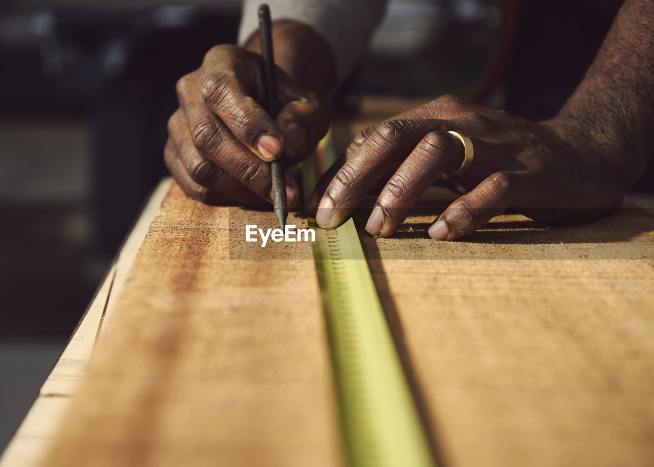 Man working on wooden table