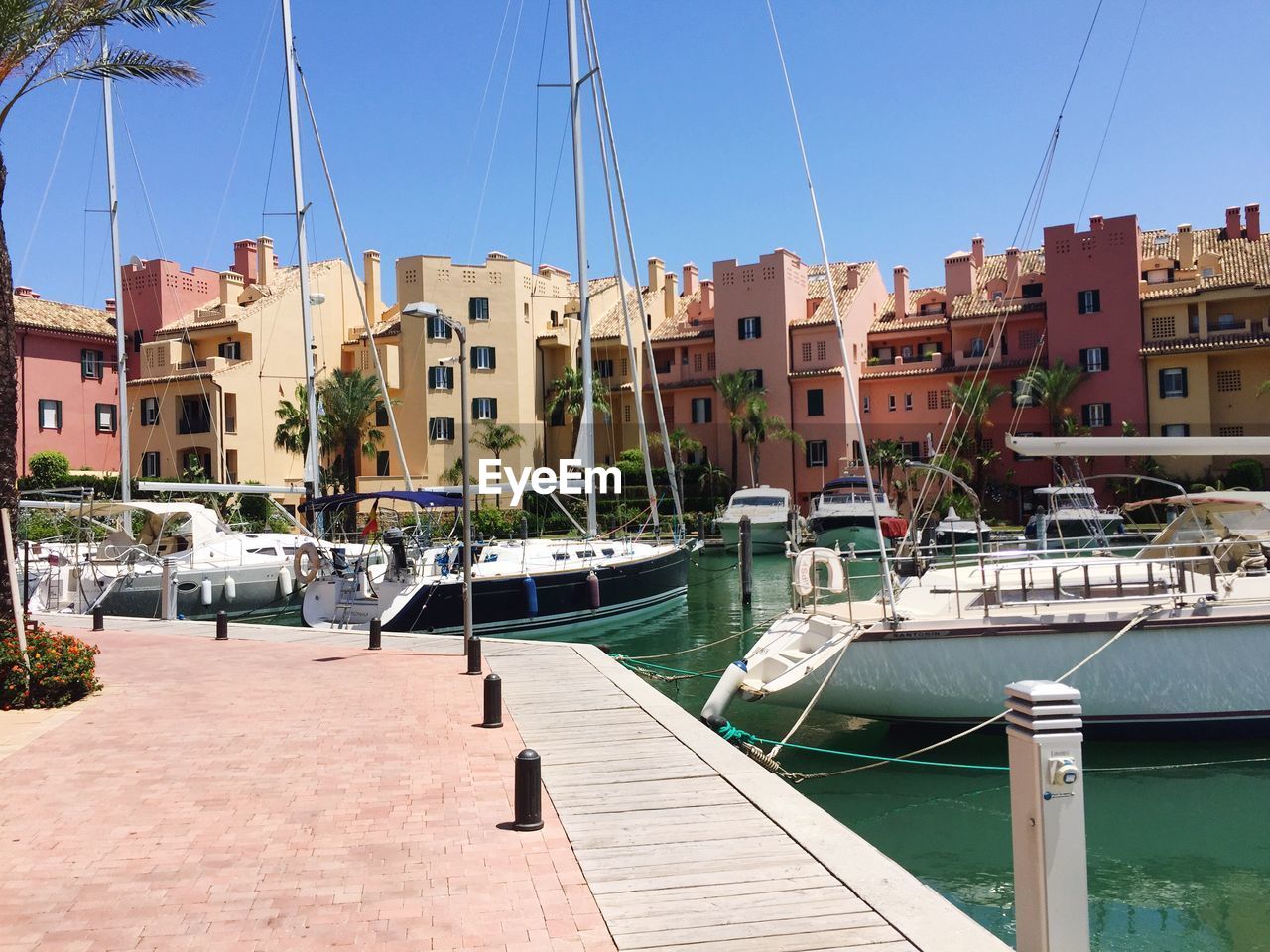 BOATS MOORED IN HARBOR