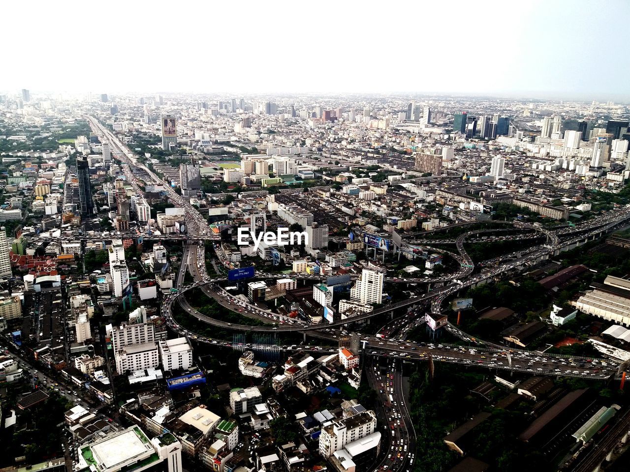 High angle view of illuminated city against sky