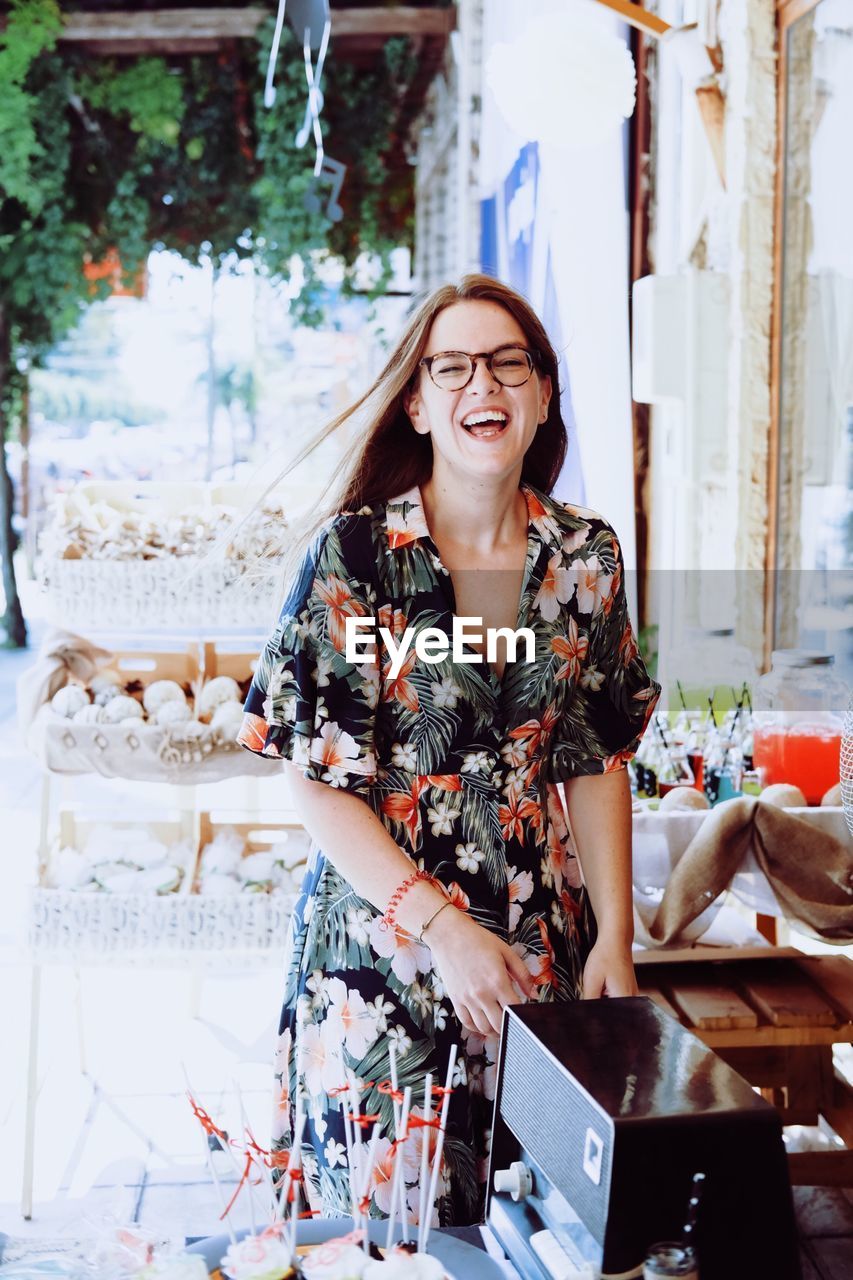 Cheerful woman standing outdoors