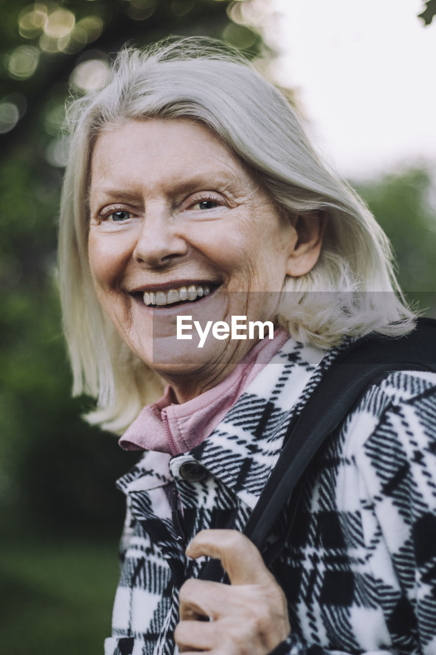 Portrait of happy senior woman with white hair