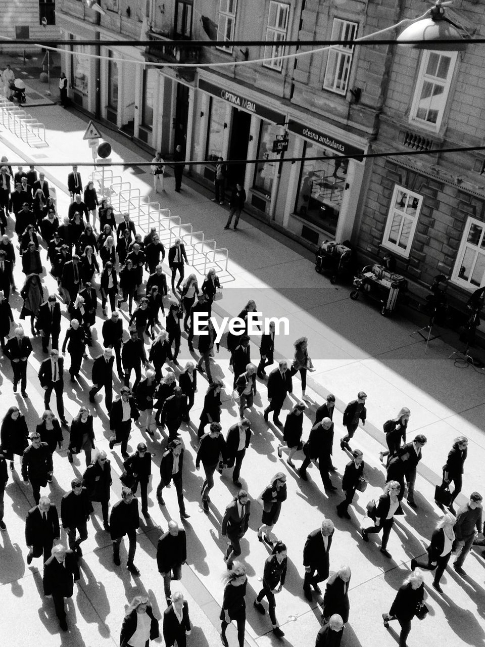 HIGH ANGLE VIEW OF PEOPLE ON STREET IN CITY