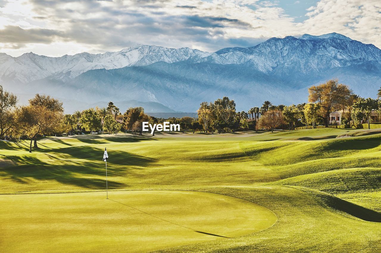 High angle view of golf course against sky