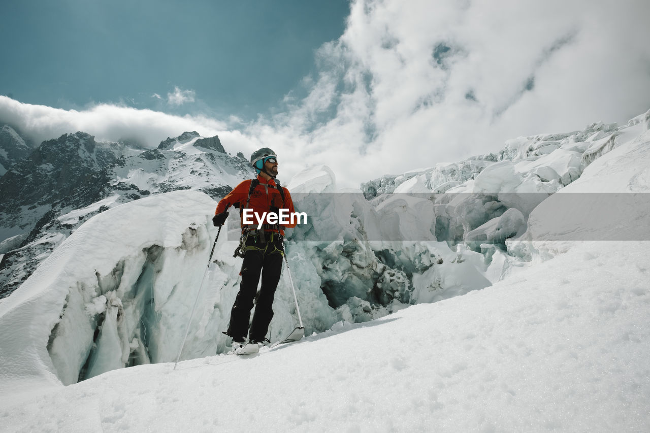 Man skiing on snow covered mountain