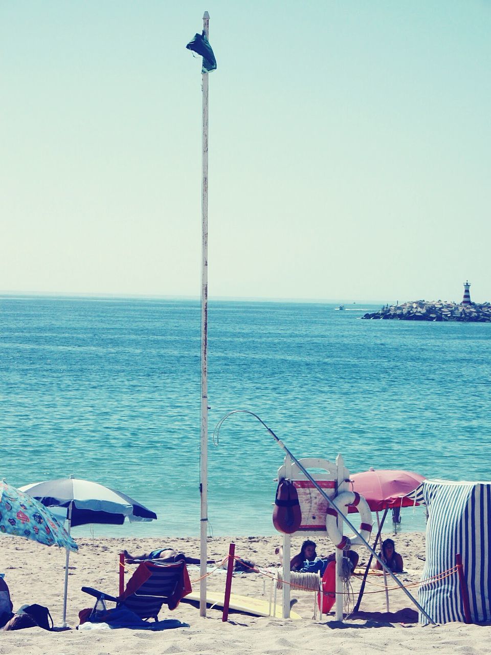 VIEW OF BEACH AGAINST CLEAR SKY