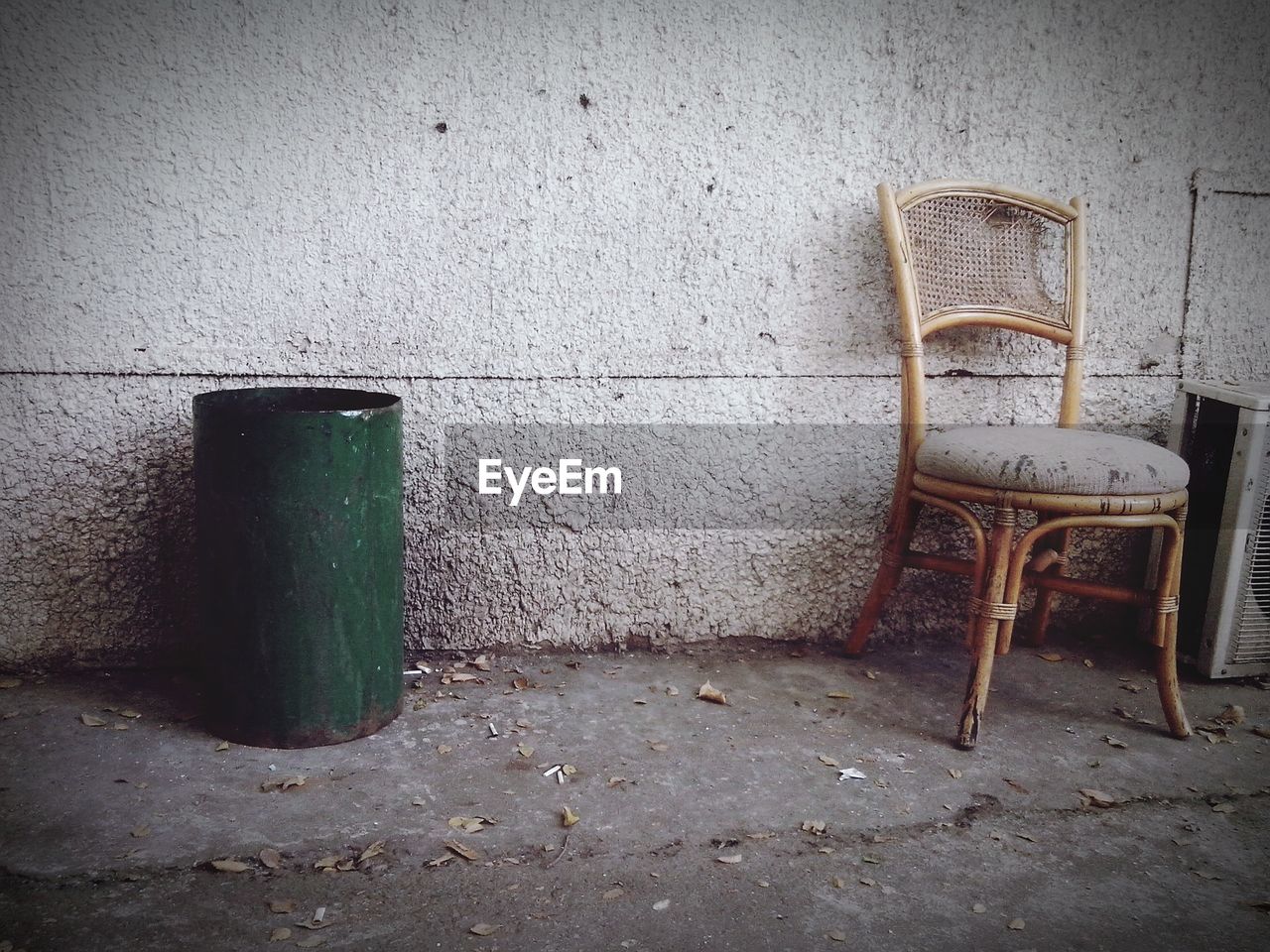 CLOSE-UP OF CHAIR IN ABANDONED BUILDING