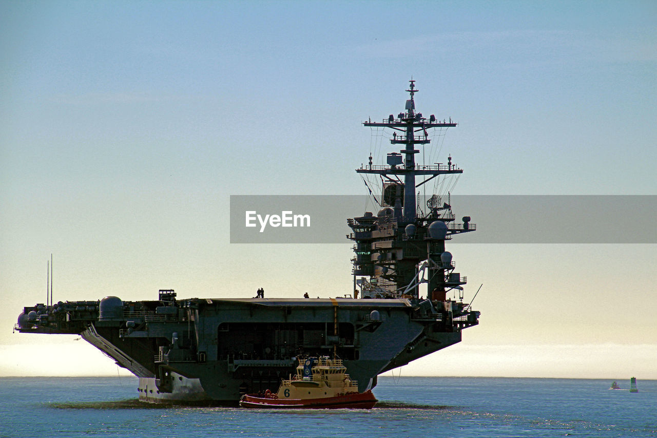 SHIP IN SEA AGAINST SKY