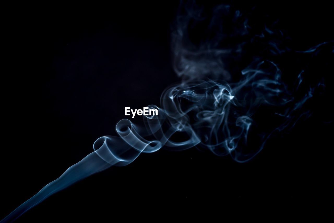 Close-up of smoke against black background