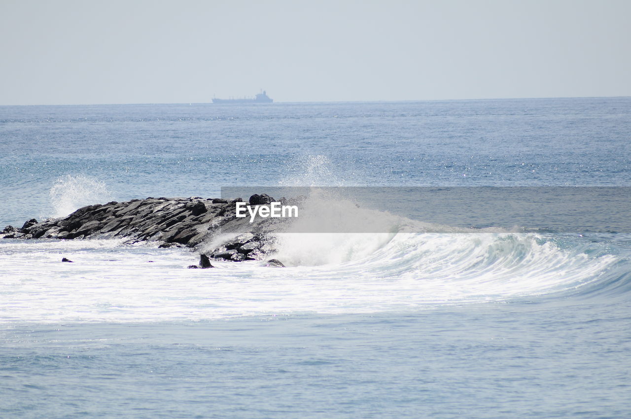 Scenic view of sea against clear sky