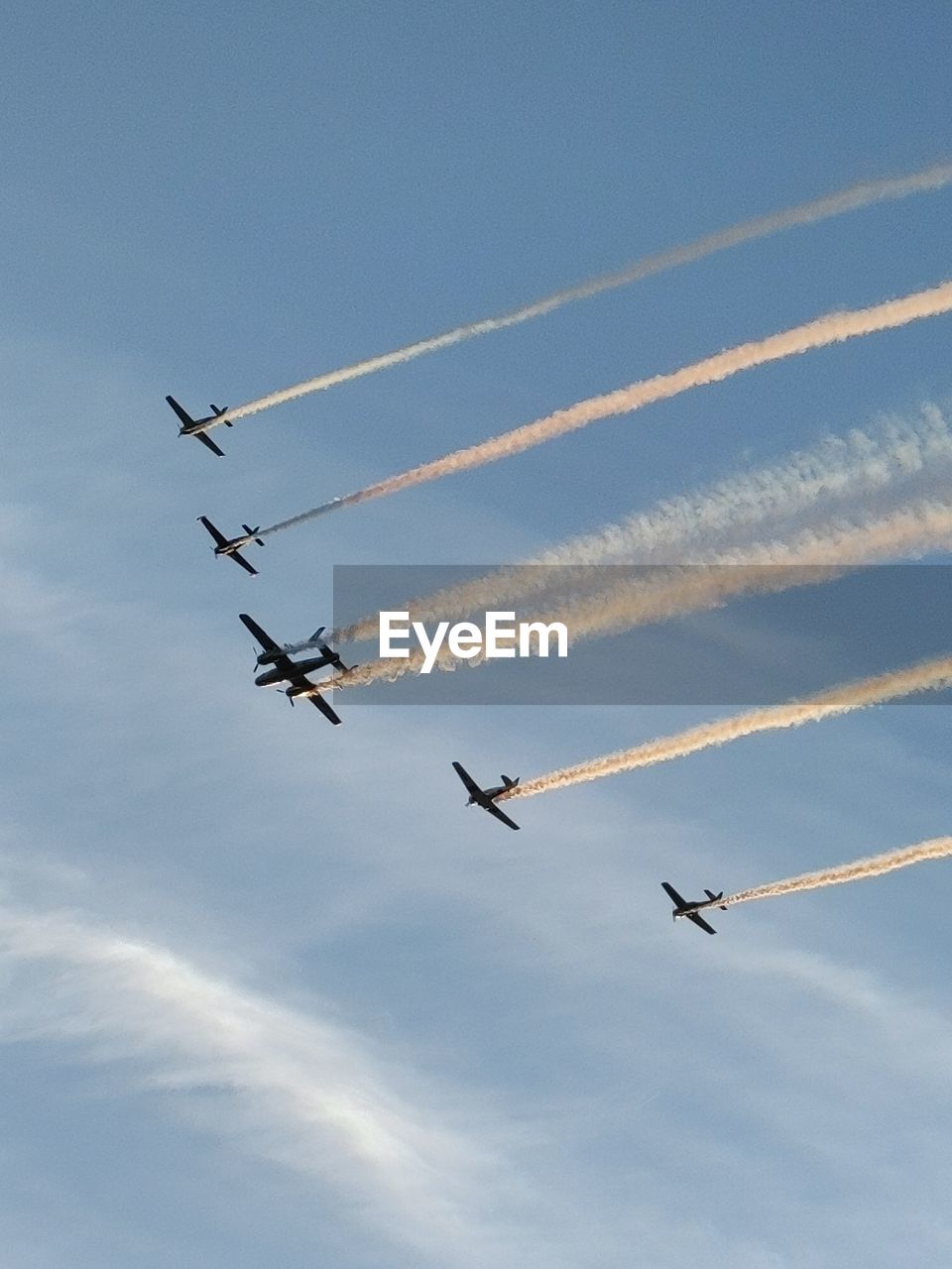 Low angle view of airplane flying against sky