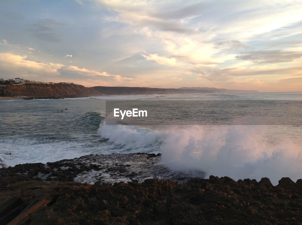 Scenic view of sea against dramatic sky