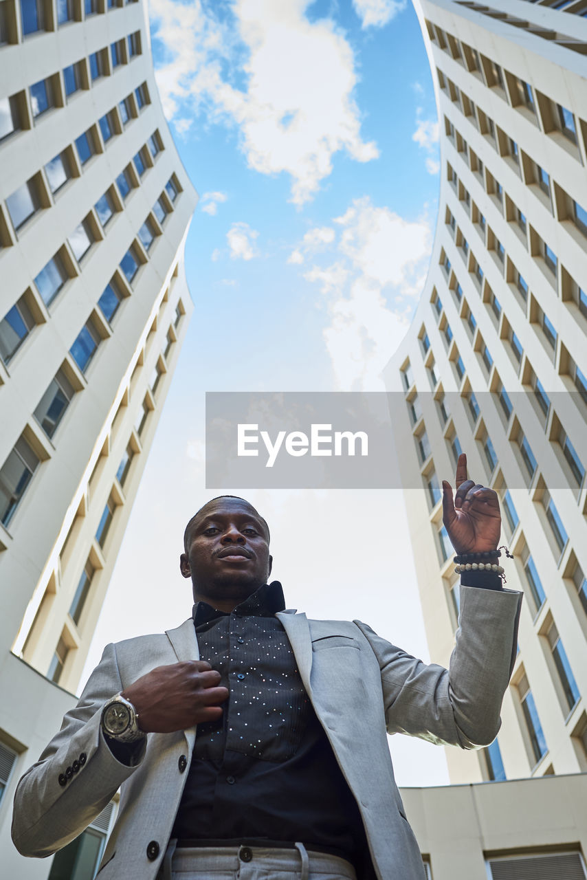 African american businessman between buildings