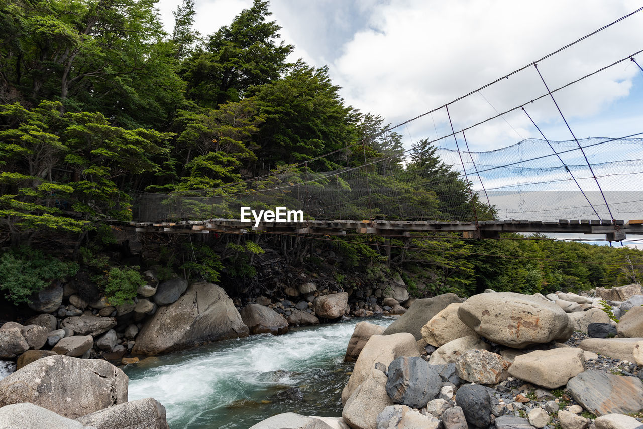 Bridge over river against sky