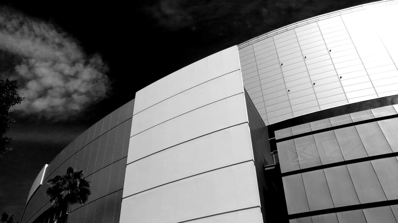 LOW ANGLE VIEW OF OFFICE BUILDING AGAINST SKY