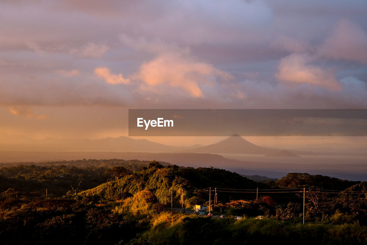 Scenic view of mountains against sky at sunset