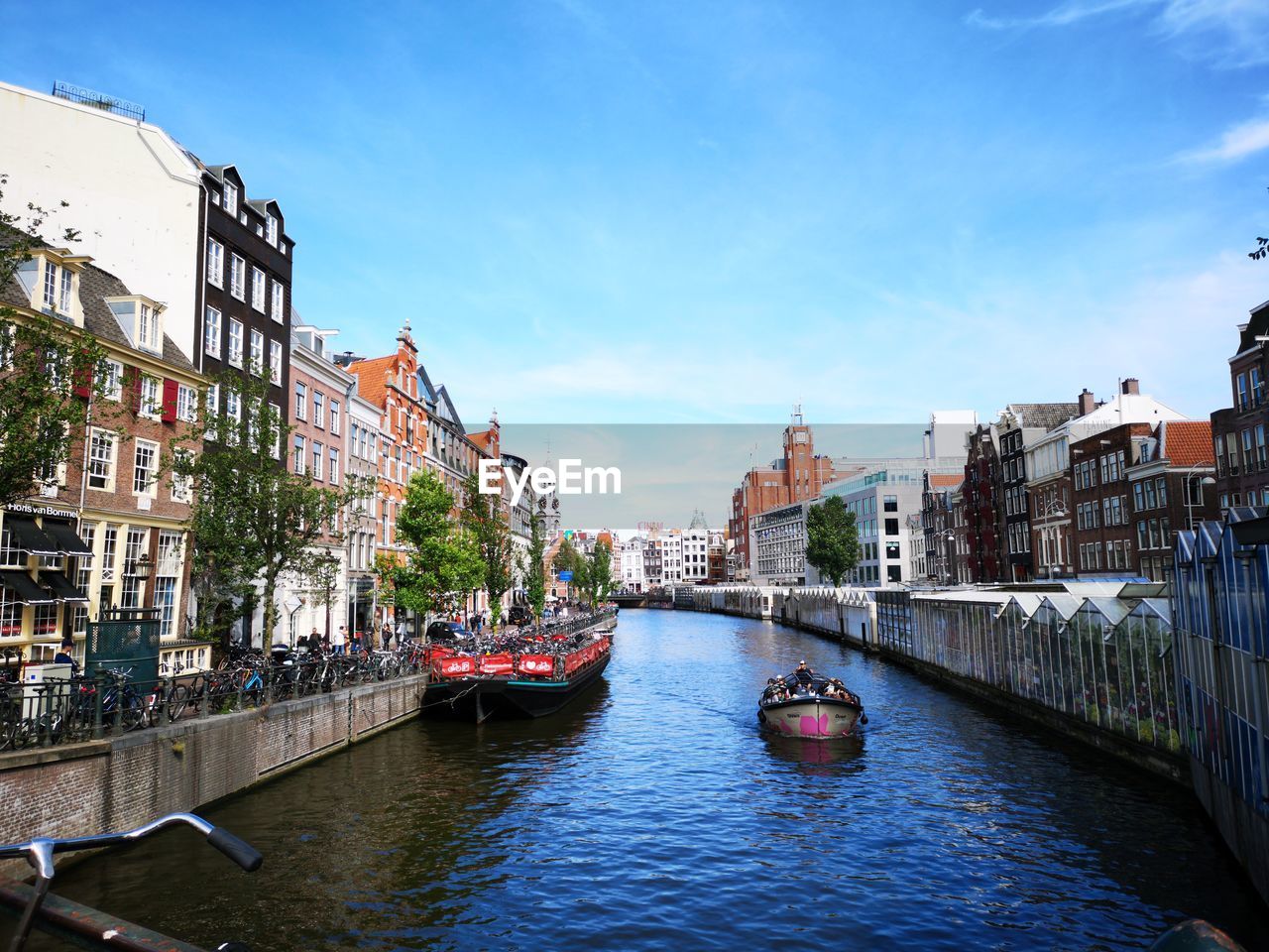 CANAL AMIDST BUILDINGS IN CITY