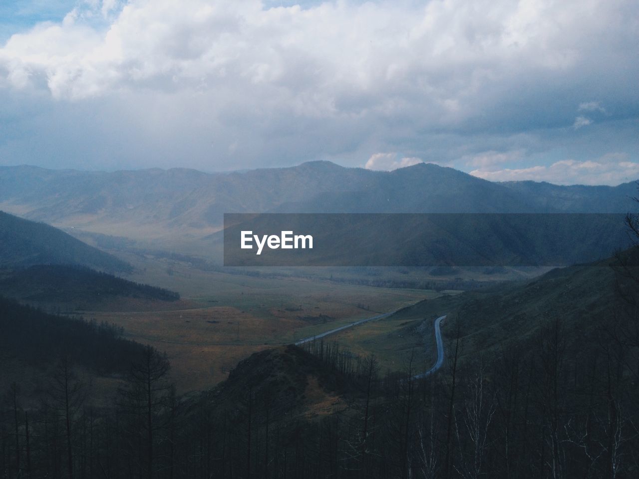 Scenic view of mountains against sky. chike-taman