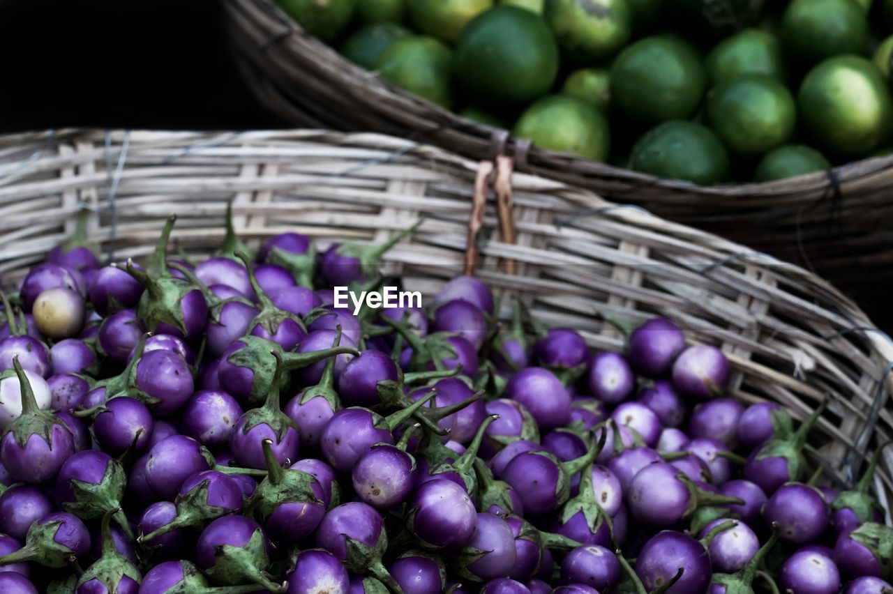 High angle view of eggplants in basket for sale