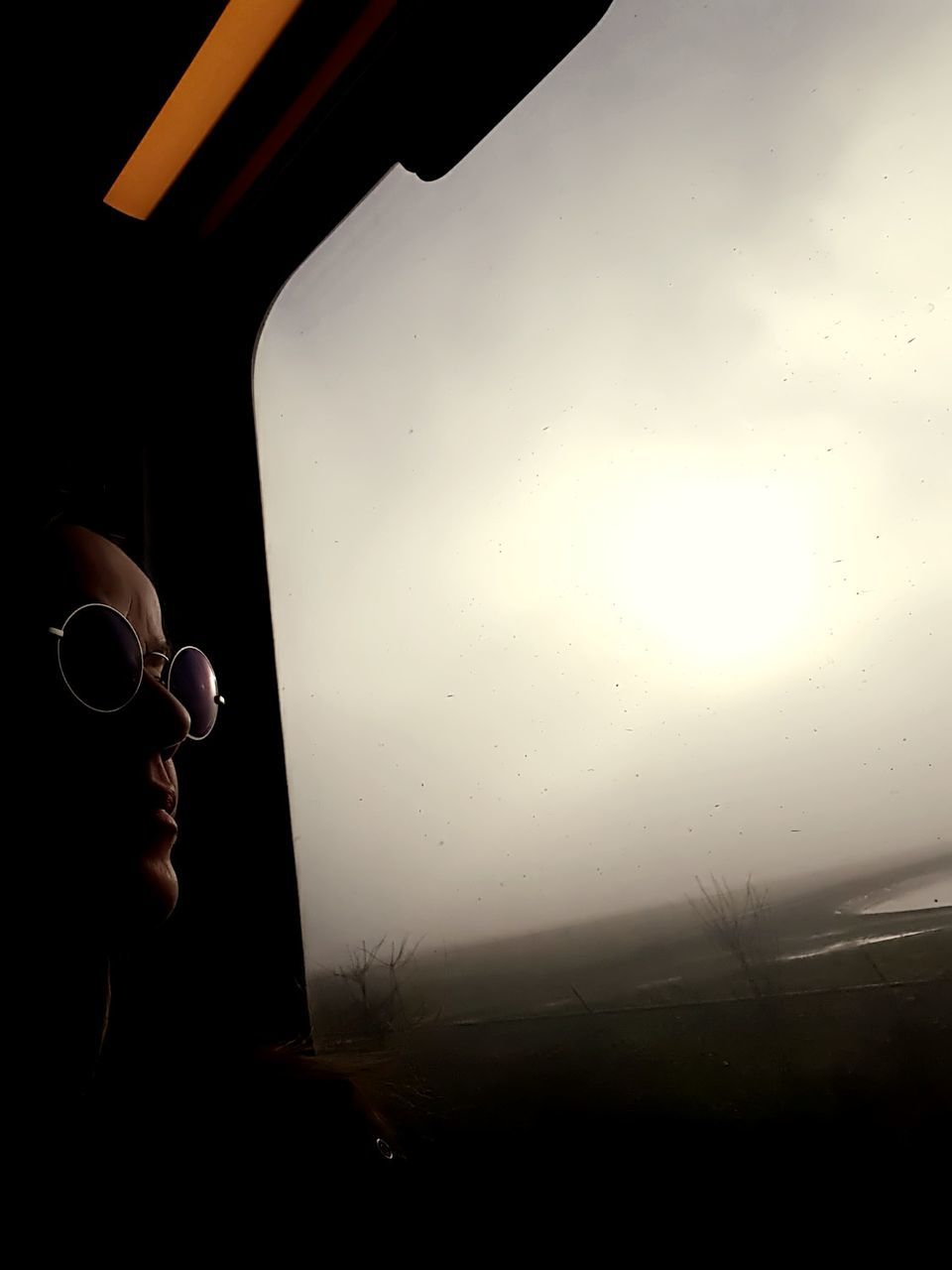 Woman looking through window