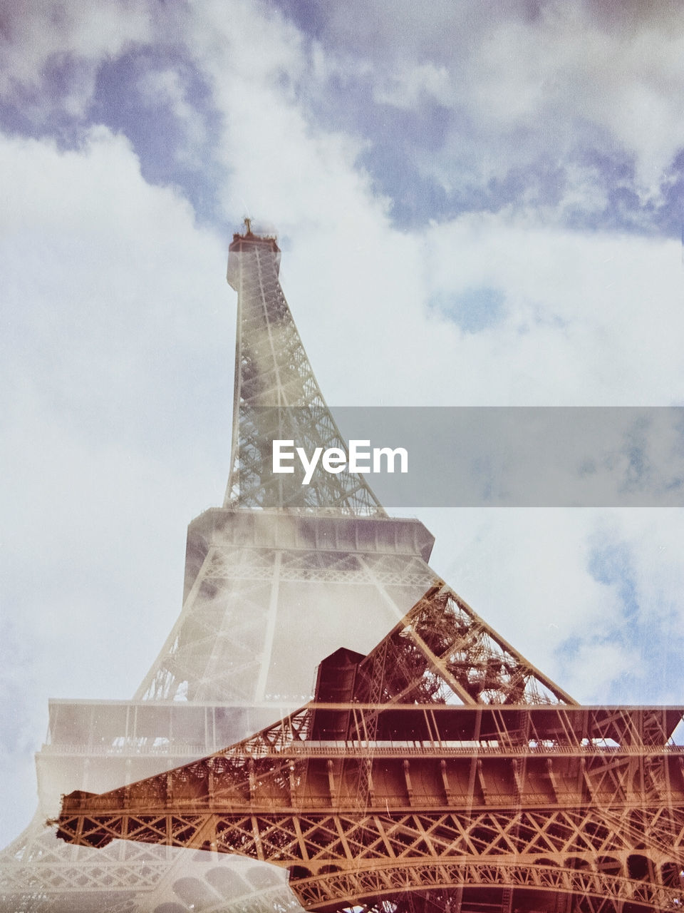 Digital composite image of eiffel tower against sky