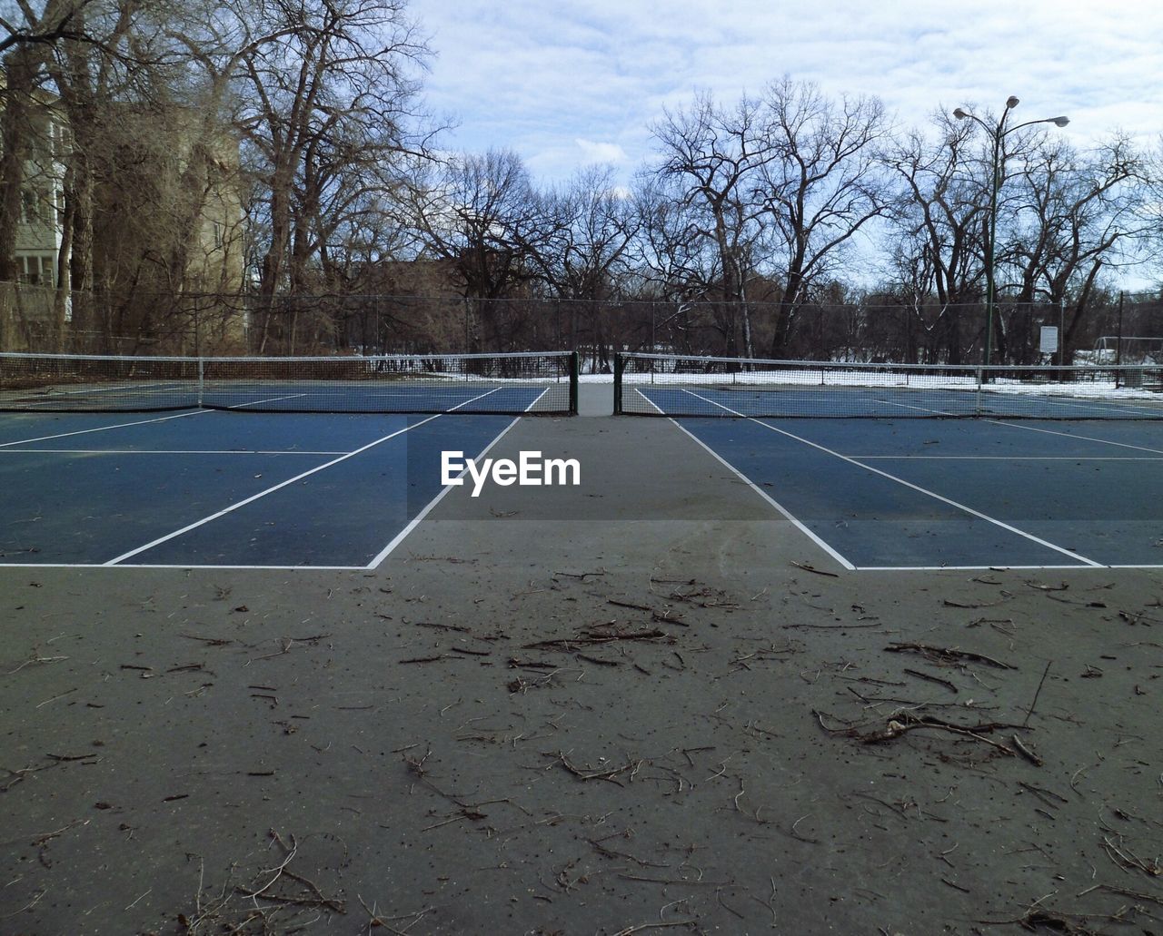 Empty tennis court against sky