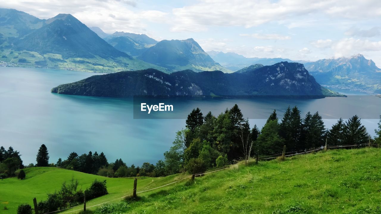 Scenic view of landscape and mountains against sky