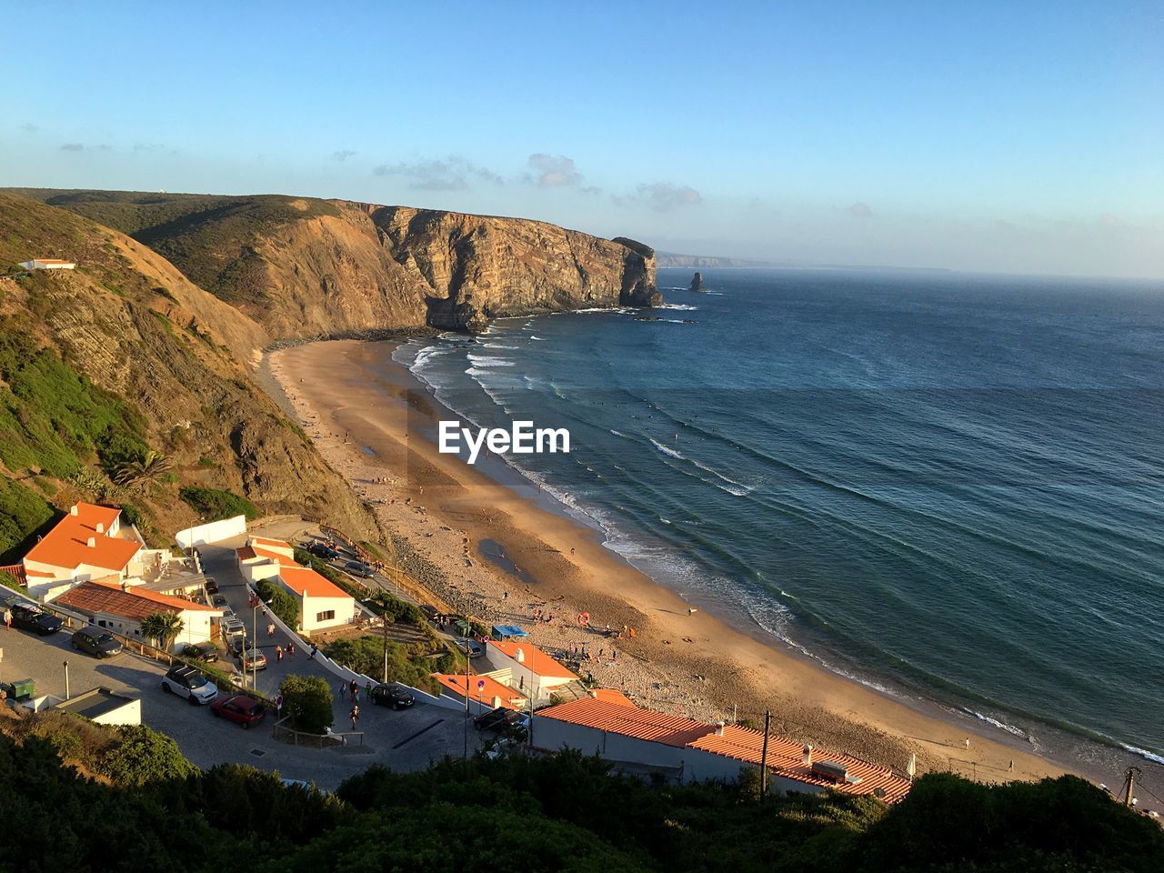 Scenic view of mountains and sea against sky