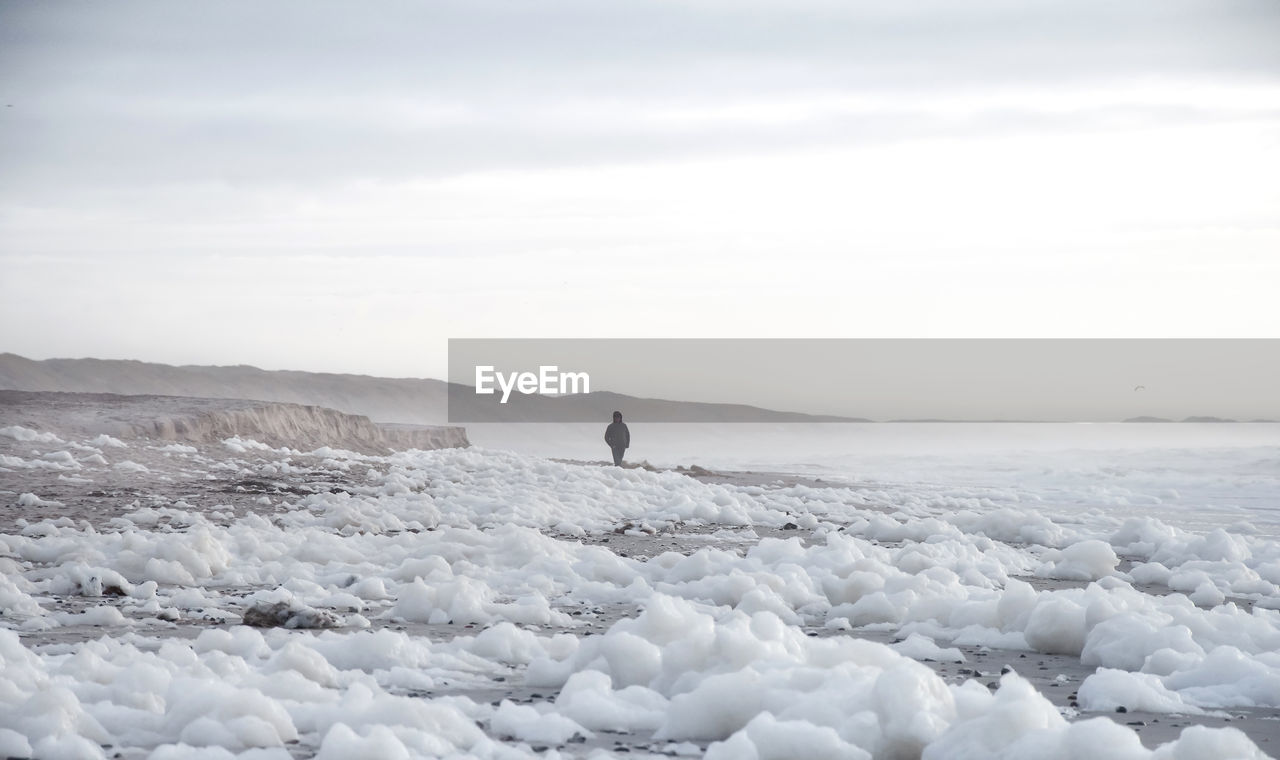 Scenic view of snow covered landscape against sky during winter