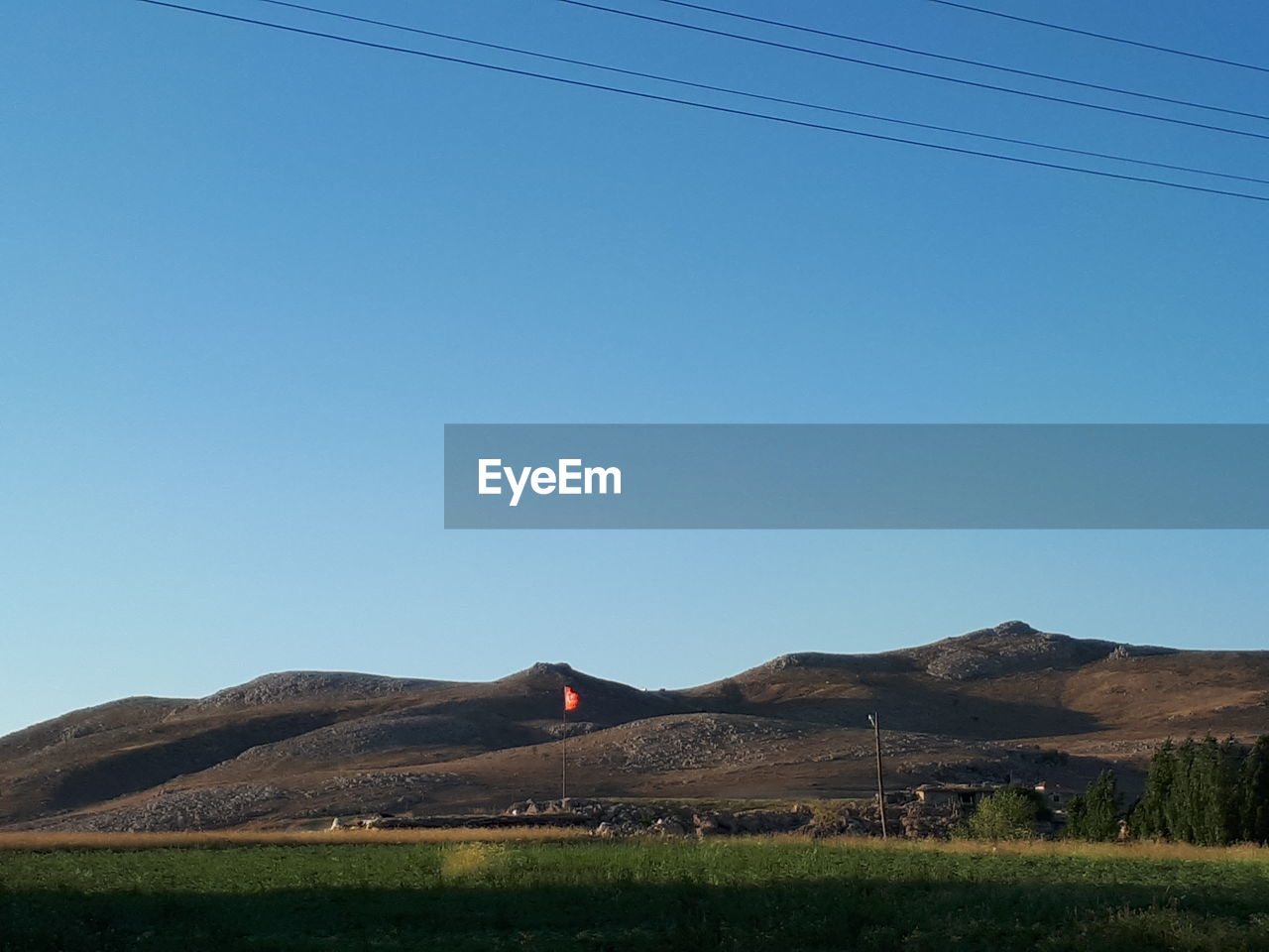 SCENIC VIEW OF LAND AGAINST CLEAR BLUE SKY