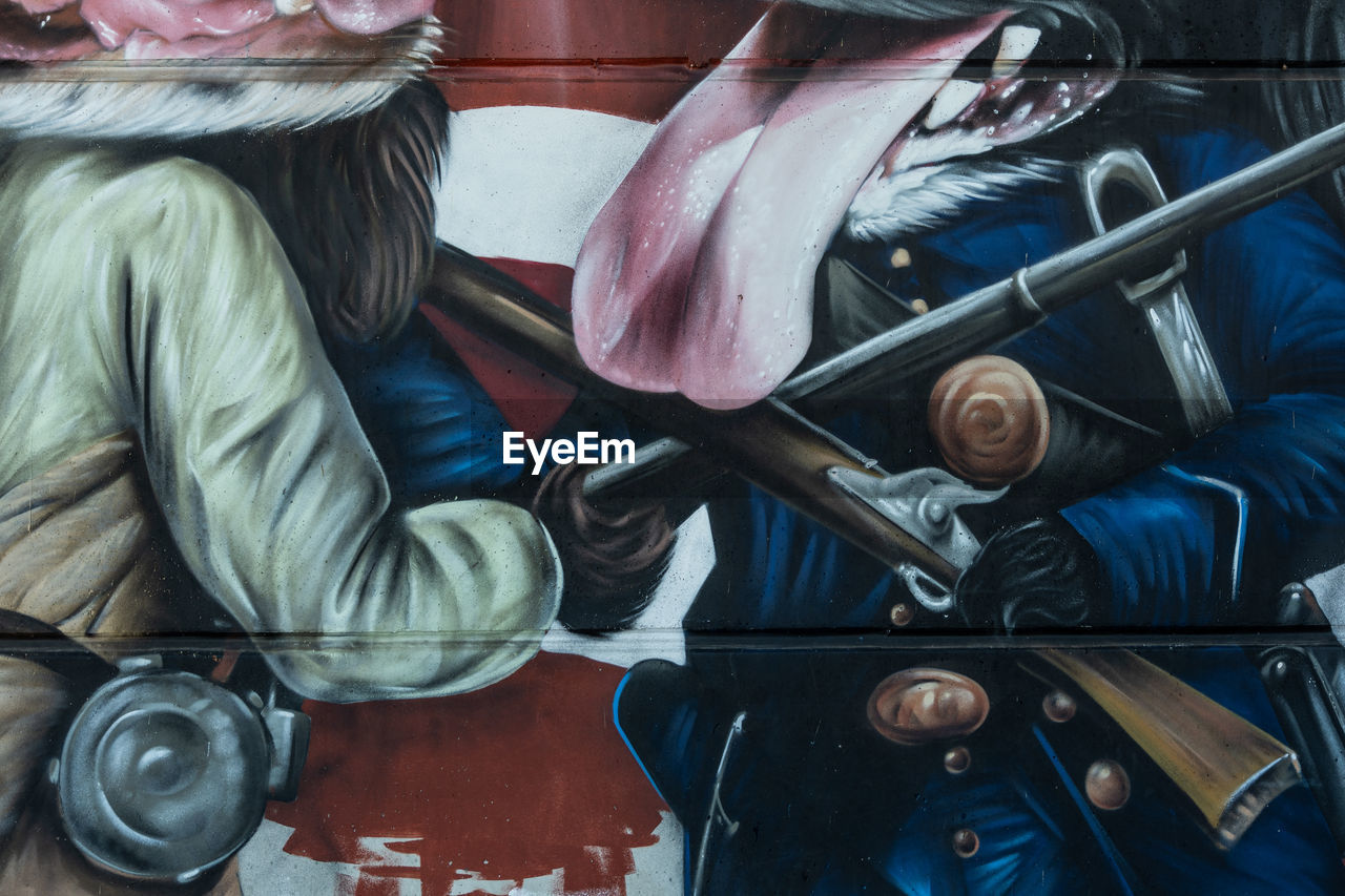 CLOSE-UP OF PEOPLE SITTING IN SHOPPING CARTS