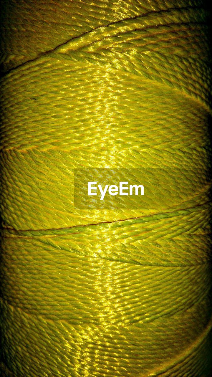 Full frame shot of yellow thread