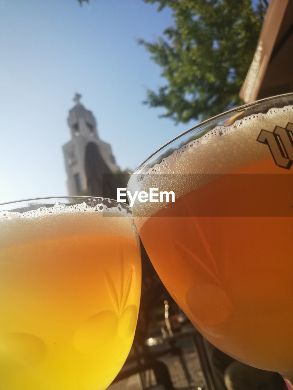 CLOSE-UP OF BEER IN GLASS ON TABLE