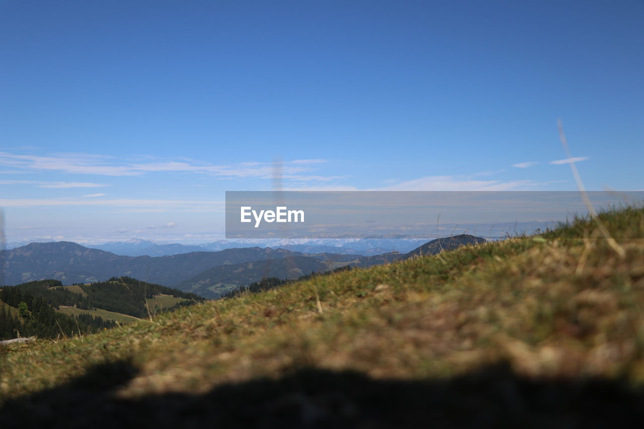 SCENIC VIEW OF LANDSCAPE AGAINST BLUE SKY