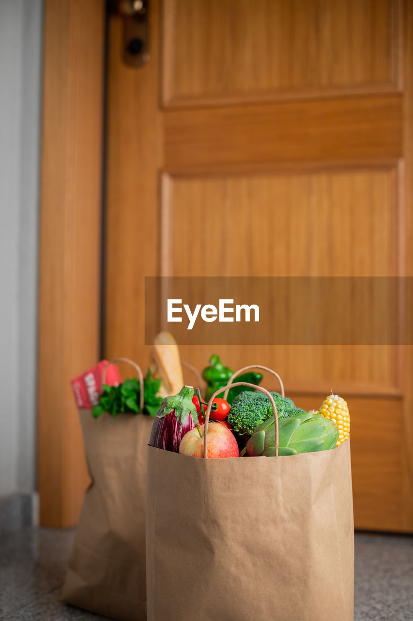 Food shopping box stand at the door of the house or apartment. 