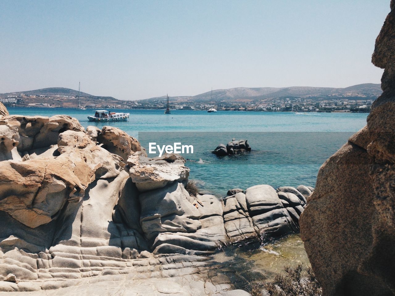 Scenic view of sea with mountains in background