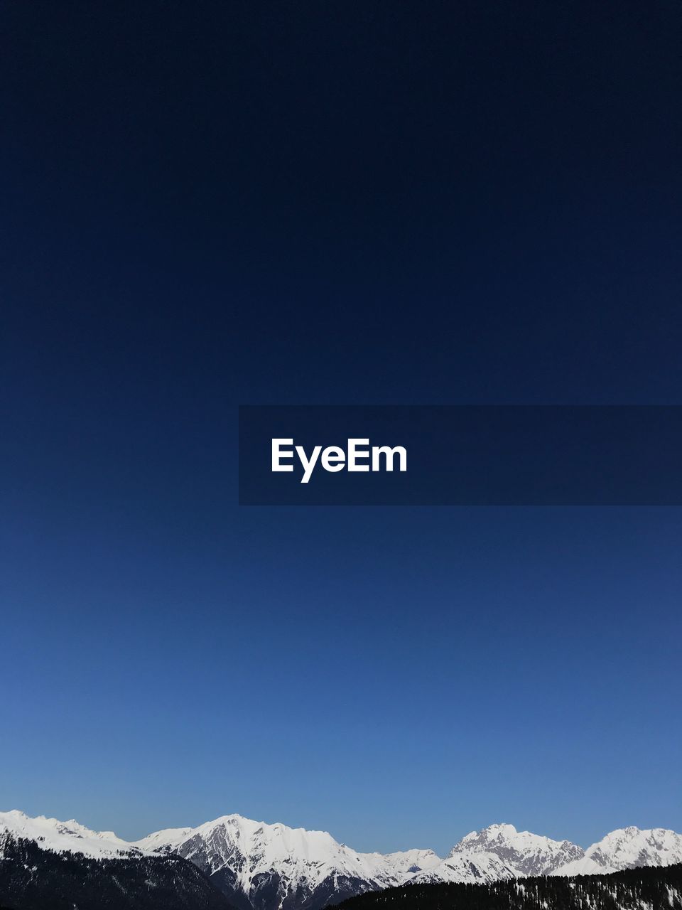 SNOWCAPPED MOUNTAIN AGAINST CLEAR BLUE SKY