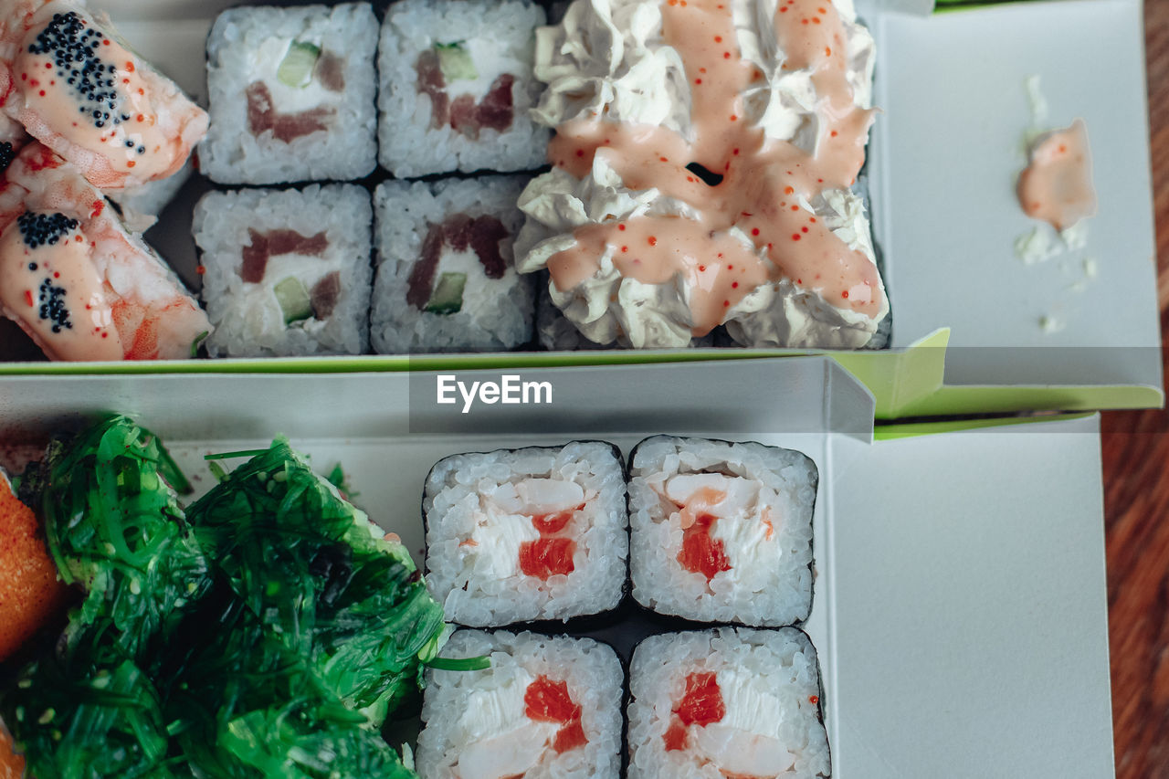 food and drink, food, freshness, cuisine, seafood, healthy eating, asian food, japanese food, wellbeing, sushi, japanese cuisine, rice, dish, california roll, indoors, no people, meal, still life, culture, variation, gimbap, fish, high angle view, close-up, container, serving size, table, plate, bento, raw food