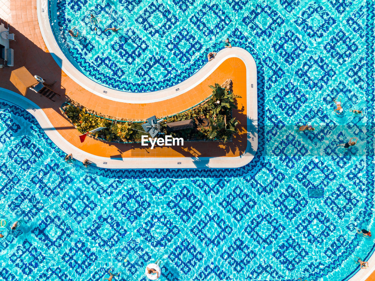 Aerial view of the outdoor swimming pool in a luxury hotel.