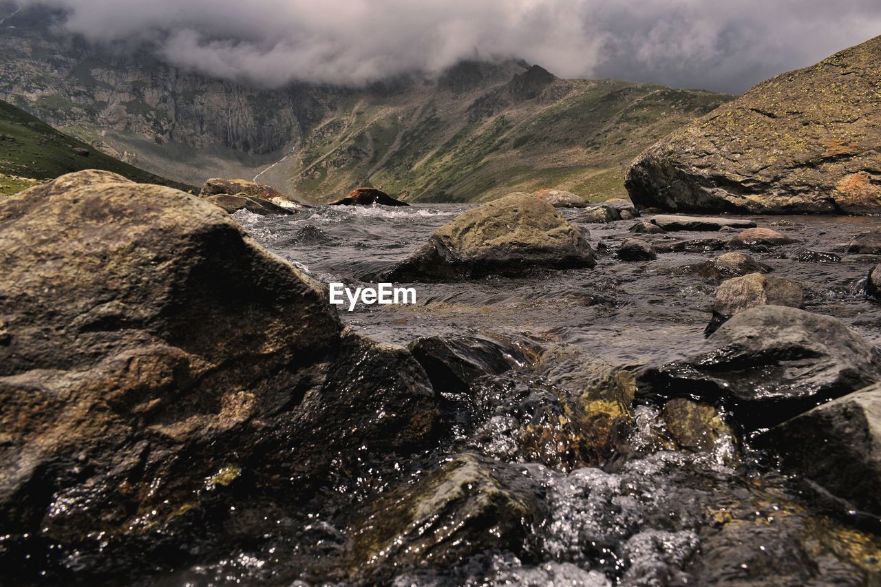 Rocks in mountains against sky