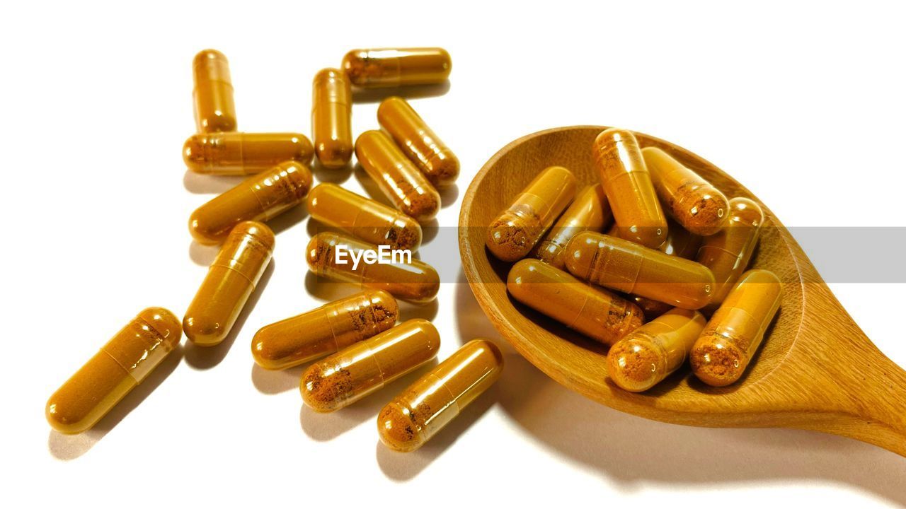 cut out, white background, capsule, pill, healthcare and medicine, medicine, dose, nutritional supplement, gold, ammunition, studio shot, bullet, vitamin, no people