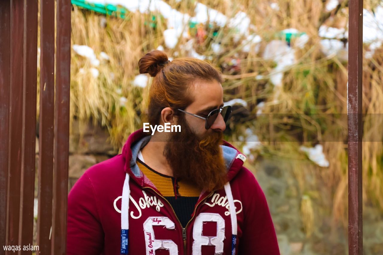 YOUNG MAN WITH SUNGLASSES